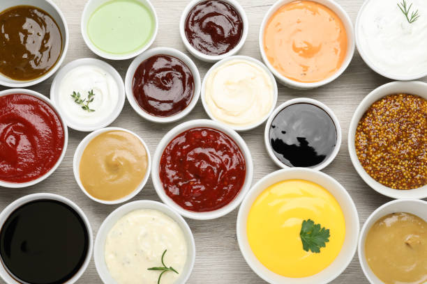istock Many different sauces on white wooden table, flat lay 1437246429