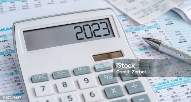 A Calculator With The 2023 On The Display Stock Photo - Download Image Now - Tax, Budget, 2023