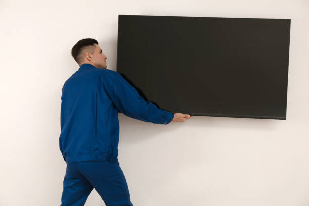 istock Professional technician installing modern flat screen TV on wall indoors 1437248544