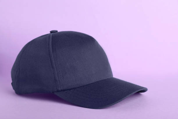 istock Baseball cap on violet background. Mock up for design 1437250165