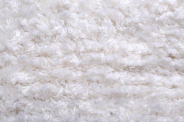 istock Soft white knitted fabric as background, top view 1437250442