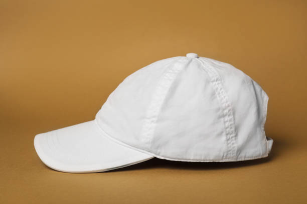 istock Baseball cap on brown background. Mock up for design 1437252439
