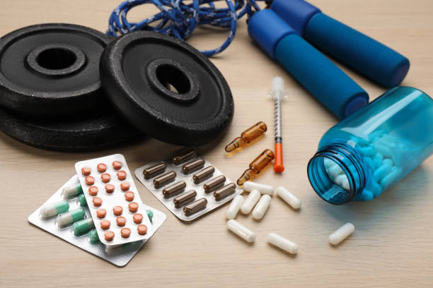 Composition with drugs on wooden table. Doping control Composition with drugs on wooden table. Doping control anti doping stock pictures, royalty-free photos & images