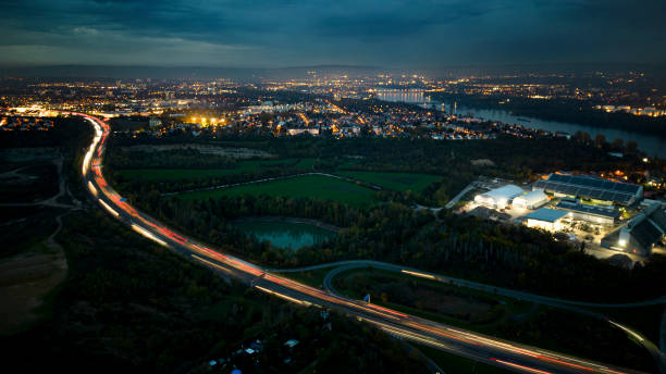 istock Aerial view over illuminated city at dusk 1437255849