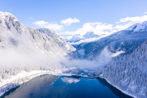 A mesmerizing shot of a lake and snow-covered mountains