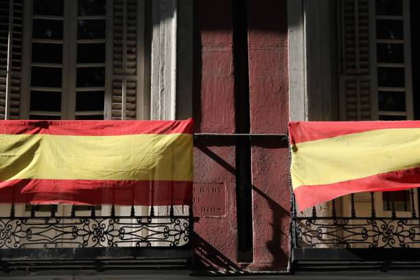 istock Sunny scenery of building balconies with Spain flags 1437256488