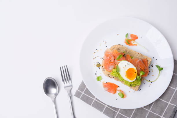istock Bread with avocado , vegetables fruit and egg on white background , Healthy breakfast concept 1437256757