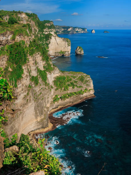 istock Scenic cliffs with blue ocean in Nusa Penida island 1437257931