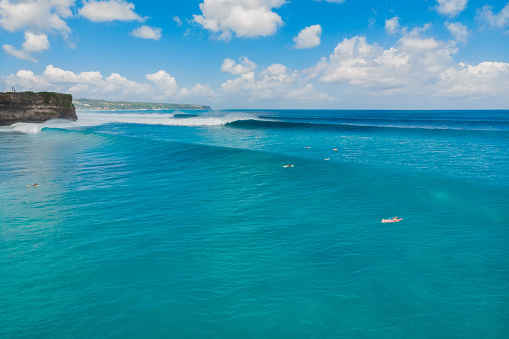 Aerial view of big waves and surfing in Bali. Balangan beach