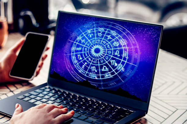 Astrological forecast for the zodiac signs. school of astrology. Astrological forecast for the zodiac signs. Woman sitting in cafe with open laptop with a picture of the zodiac circle. school of astrology. Forecast for the future astrology stock pictures, royalty-free photos & images