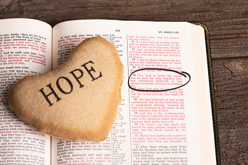 Bible and heart with word HOPE