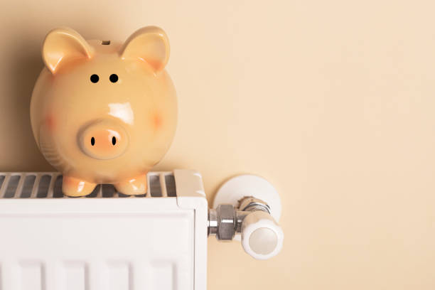 istock Piggy bank  sit on a radiator 1437258202