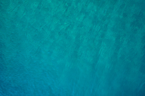 Aerial view of the turquoise colored sea.