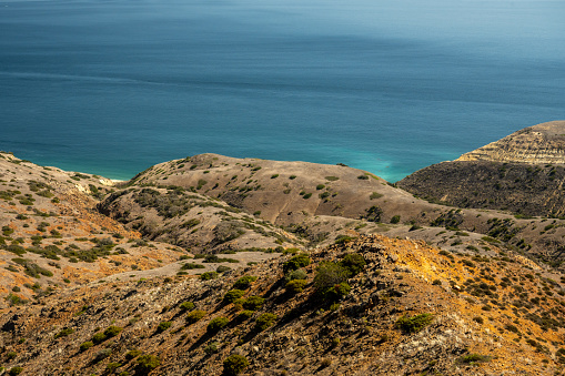 Teal Water Highlights The Beach Below Rolling Hills On Santa Cruz Island in Channel Islands National Park