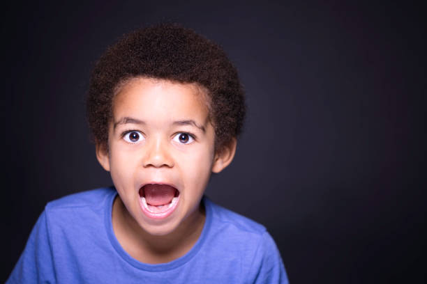 istock Five-year-old boy wearing a blue t shirt 1437262644