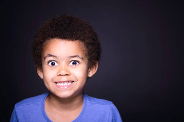 istock Five-year-old boy wearing a blue t shirt 1437262691