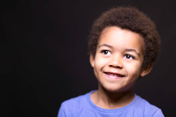istock Five-year-old boy wearing a blue t shirt 1437262835