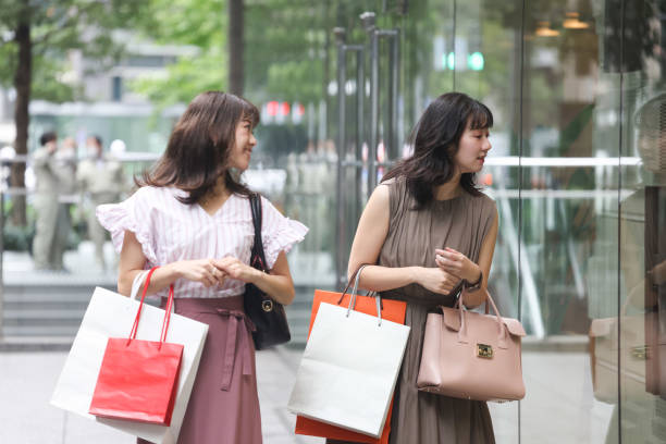 istock Beautiful young wmen enjoying shopping 1437265880
