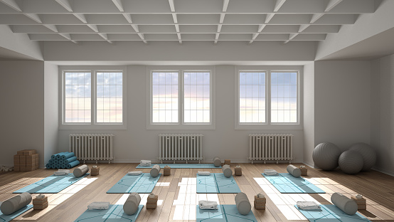 Empty yoga studio interior design architecture, classic open space, parquet, decorated ceiling, spatial organization with mats, accessories, ready for yoga practice, panoramic windows