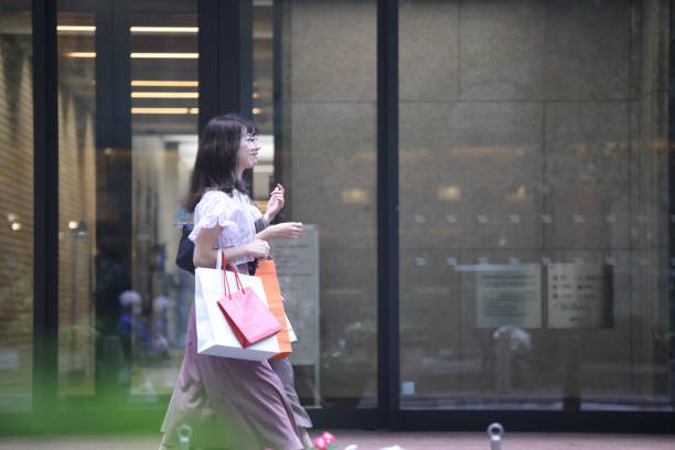 istock Beautiful young wmen enjoying shopping 1437266455
