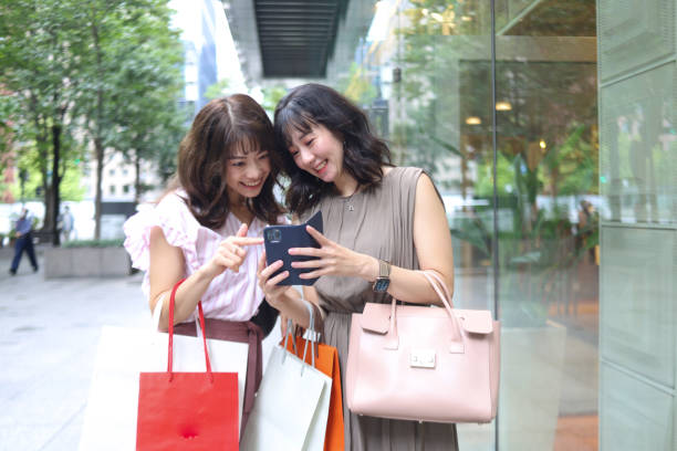 istock Beautiful young wmen enjoying shopping 1437266547