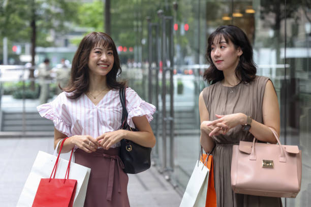 istock Beautiful young wmen enjoying shopping 1437266667
