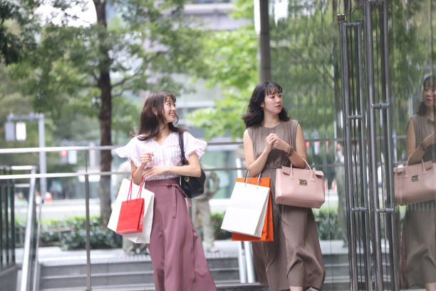 istock Beautiful young wmen enjoying shopping 1437266759