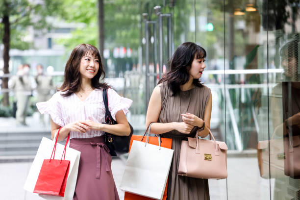 Beautiful young wmen enjoying shopping