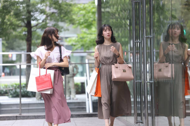 istock Beautiful young wmen enjoying shopping 1437266856