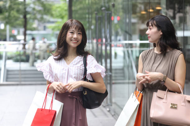 istock Beautiful young wmen enjoying shopping 1437266898