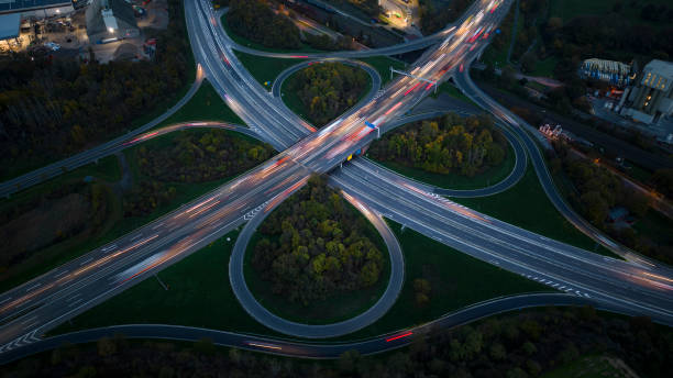 istock Highway interchange at dusk - aerial view 1437266907