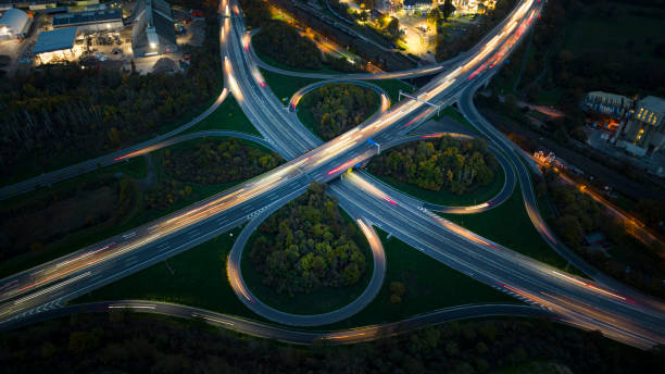 istock Highway interchange at dusk - aerial view 1437266914