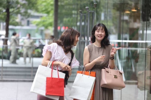 istock Beautiful young wmen enjoying shopping 1437266938