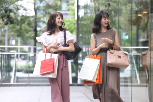 istock Beautiful young wmen enjoying shopping 1437267019