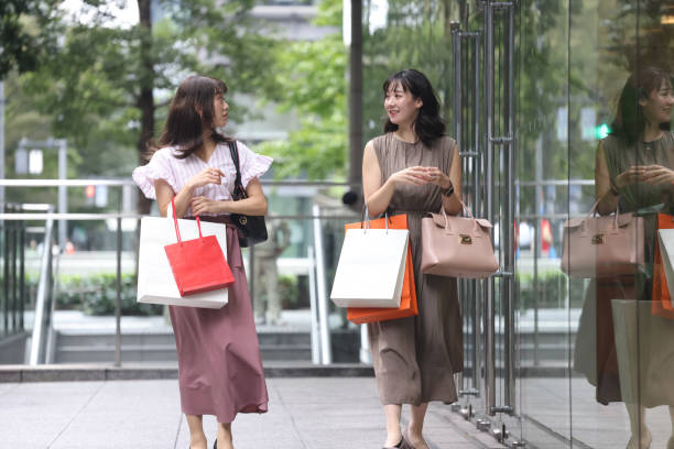 istock Beautiful young wmen enjoying shopping 1437267044