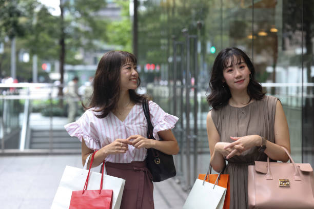 istock Beautiful young wmen enjoying shopping 1437267095