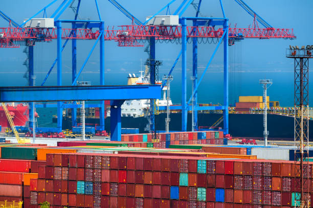 istock loading containers onto the ship, industrial seaport infrastructure, commercial dock and container warehouse, sea, cranes and cargo ship, concept of sea cargo transportation 1437272517