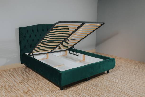 istock Green bed with a storage space revealed by lifting the wooden slatted base 1437272541