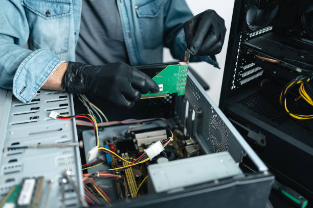 Close up of man hands repairing desktop computer. Pc repairing service concept stock photo