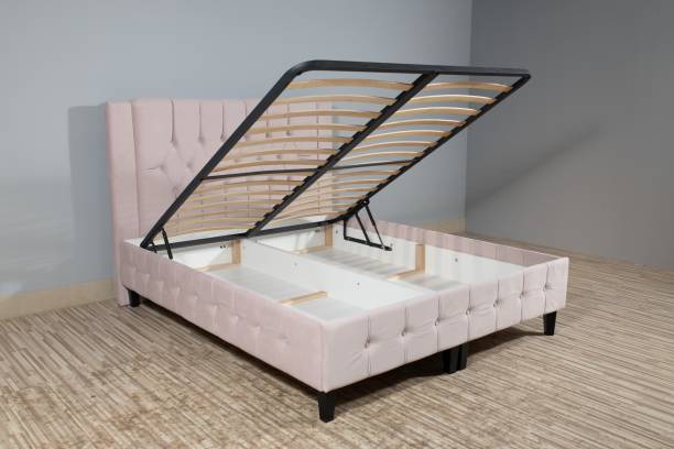 istock Pink bed with a storage space revealed by lifting the wooden slatted base 1437274002
