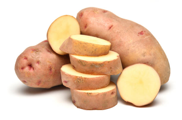 istock potatoes close up, whole and sliced, objects are isolated on a white background 1437275201