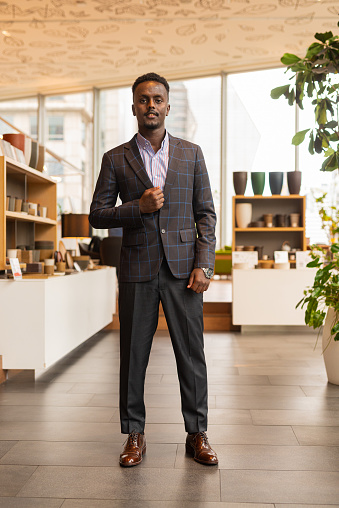 Full length portrait of African businessman wearing suit