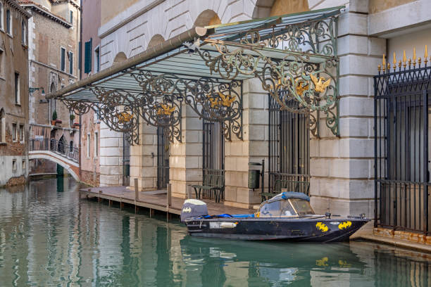 Venice, Italy - October 6th 2022:  Moored speedboat with batman stickers outside a theatre in the center of the old and famous Italian city Venice