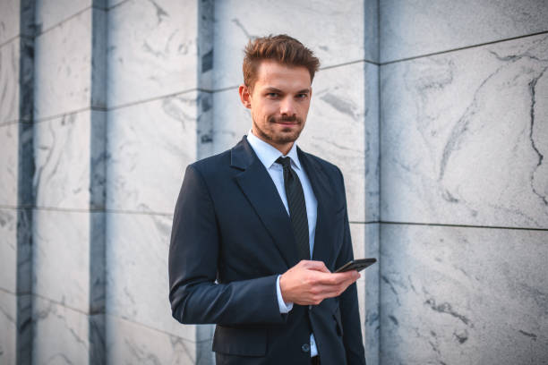 istock Confident Young Caucasian Businessman Working On The Go 1437279647