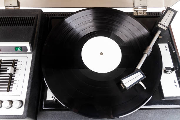 istock Vintage turntable record player with black vinyl 1437282373