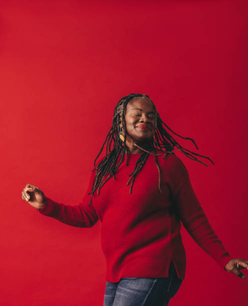istock Joyful black woman dancing and whipping her dreadlocks 1437284242