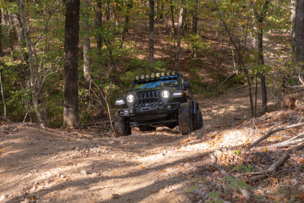 small 4x4 following designated track in a typical scene from the Flinders Ranges, South Australia (Warraweena)