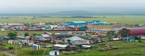 aerial view of the industrial zone of the village of Yuzhno-Kurilsk on the island of Kunashir Yuzhno-Kurilsk, Russia - August 03, 2022: aerial view of the industrial zone of the village of Yuzhno-Kurilsk on the island of Kunashir kunashir island stock pictures, royalty-free photos & images