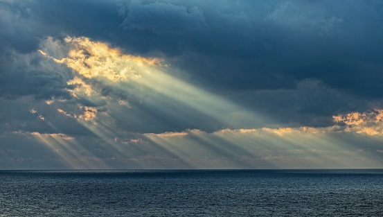 Magic sunbeam out of mighty cloudscape over North Sea at Island Helgoland