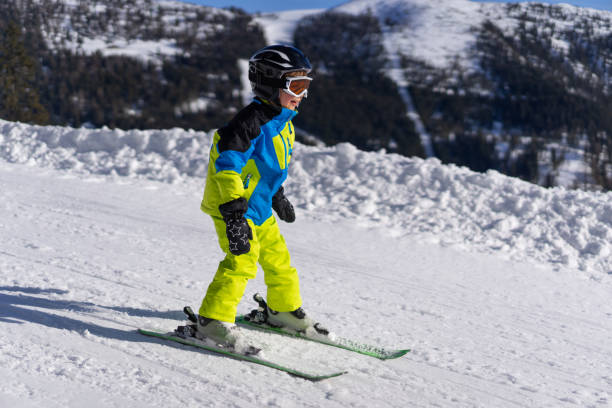 istock Happy little boy enjoying skiing 1437289830